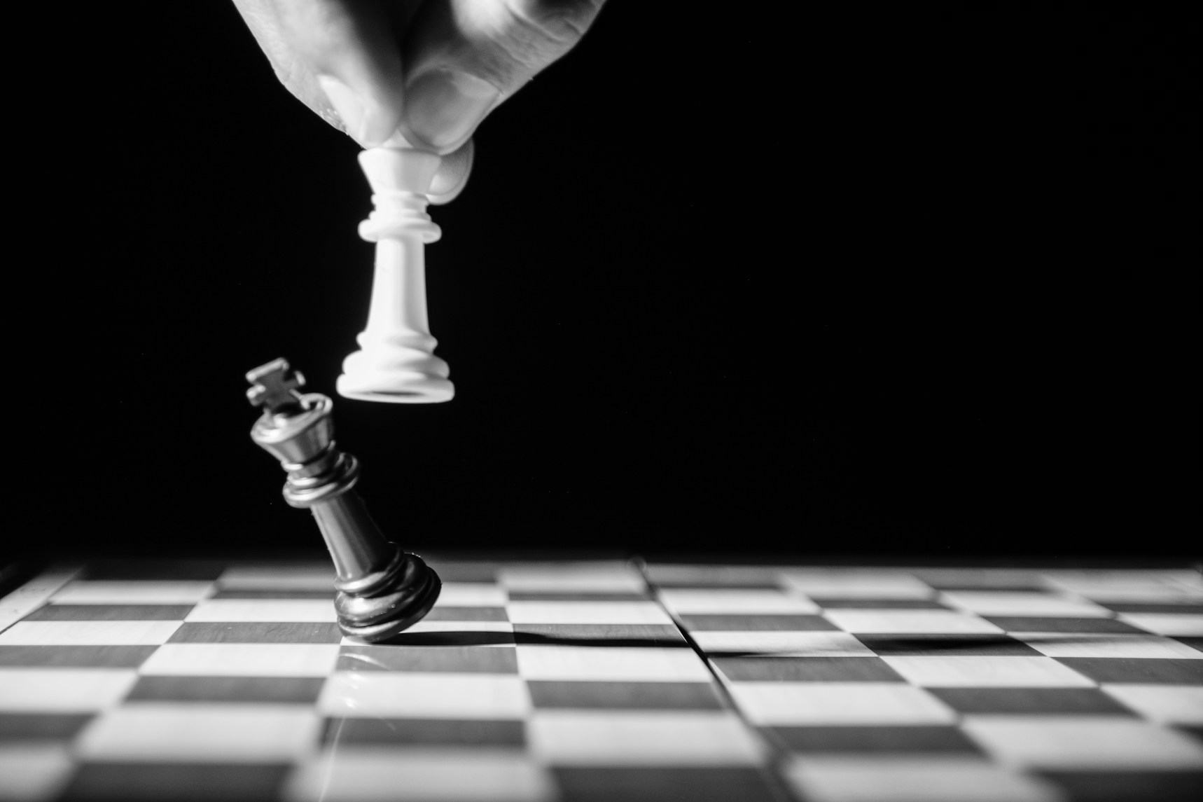 Chess pieces in defeat — the weight of institutional memory